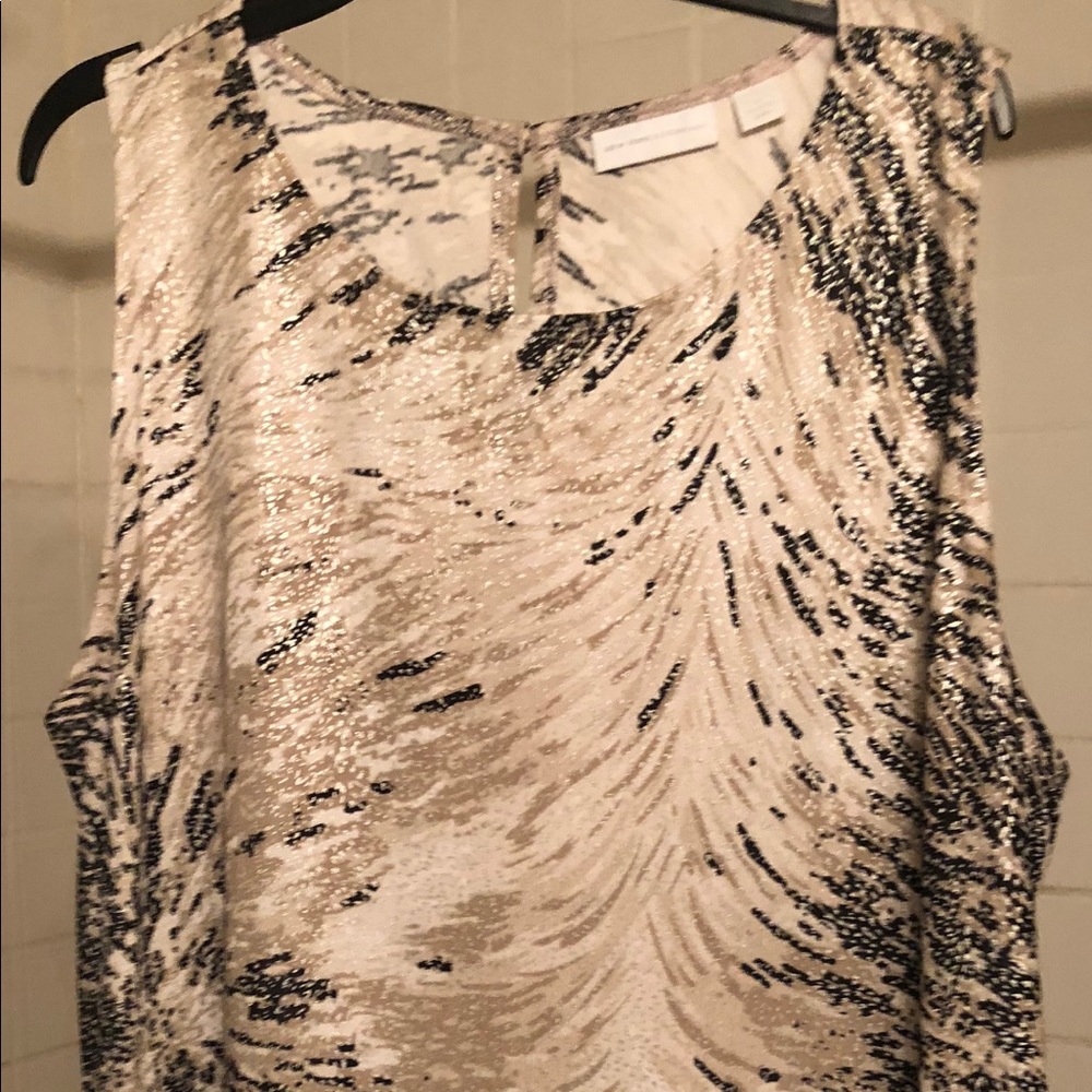 sleeveless print tunic top with asymmetrical hem.